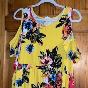 Babydoll cold shoulder style top.